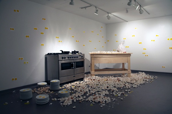(Rita McKeough's The Lion's Share, an installation with a kitchen and a chicken, dimensions variable, 2012/2013)