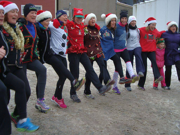 Runners break out into a song and dance at the finish line following the 2013 Ugly Sweater Run for CB children that raised about 60 gifts and $300 for 40 families in crisis - photo: Tera Camus