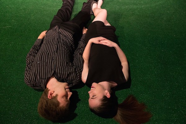Jonathan Lewis and Bhreagh MacNeil, as Jonathan and Caitlin upside down in love in Wesley J. Colford's "Mature Young Adults", directed by Anna Spencer, running Friday nights in July at The Highland Arts Theatre - photo: Chris Walzak
